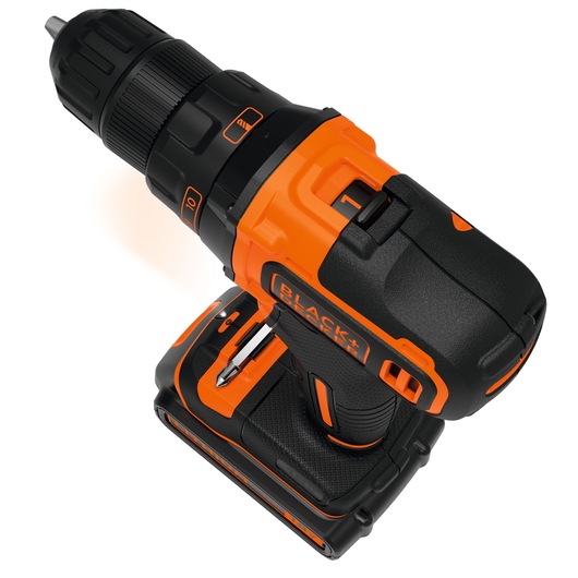 Close-up image of a BLACK+DECKER cordless drill with orange and black casing, showing detail on the handle, battery, and drill bit holder.