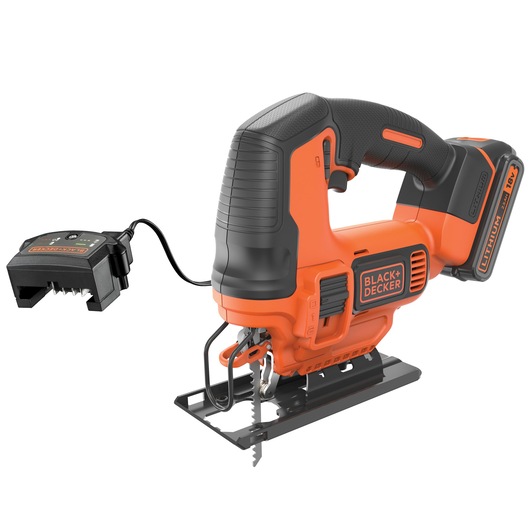 A BLACK+DECKER cordless jigsaw with an 18V lithium battery and charger. The tool is orange and black, featuring a comfortable handle and a visible jigsaw blade at the base.