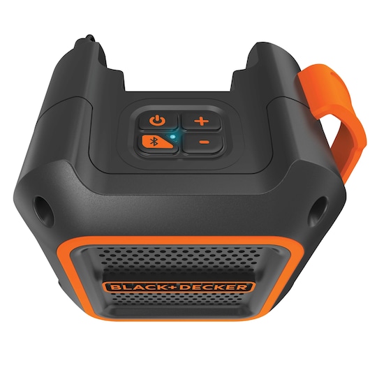 Close-up of a BLACK+DECKER portable Bluetooth speaker with black and orange design, featuring control buttons on the top and branding on the front grille.