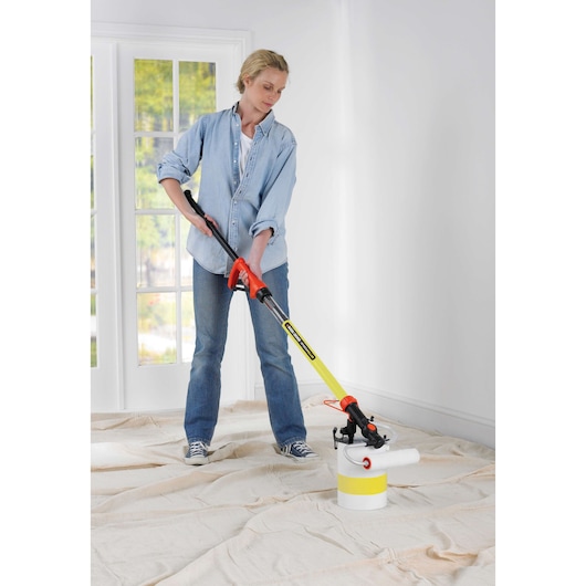BLACKDECKER BDPR400 paint roller on extension handle in use indoors, photography product.