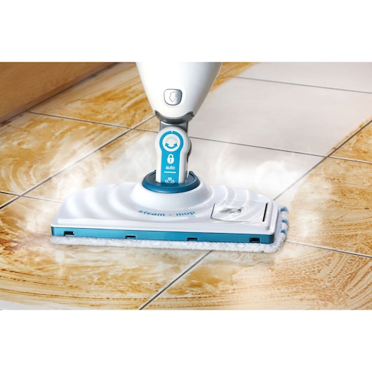 BLACKDECKER FSMP20 steam mop cleaning dirty tile floor, close-up photography from front angle.