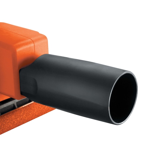 Close-up view of a BLACK+DECKER KA300 sander showing the black dust extraction attachment connected to the orange body.